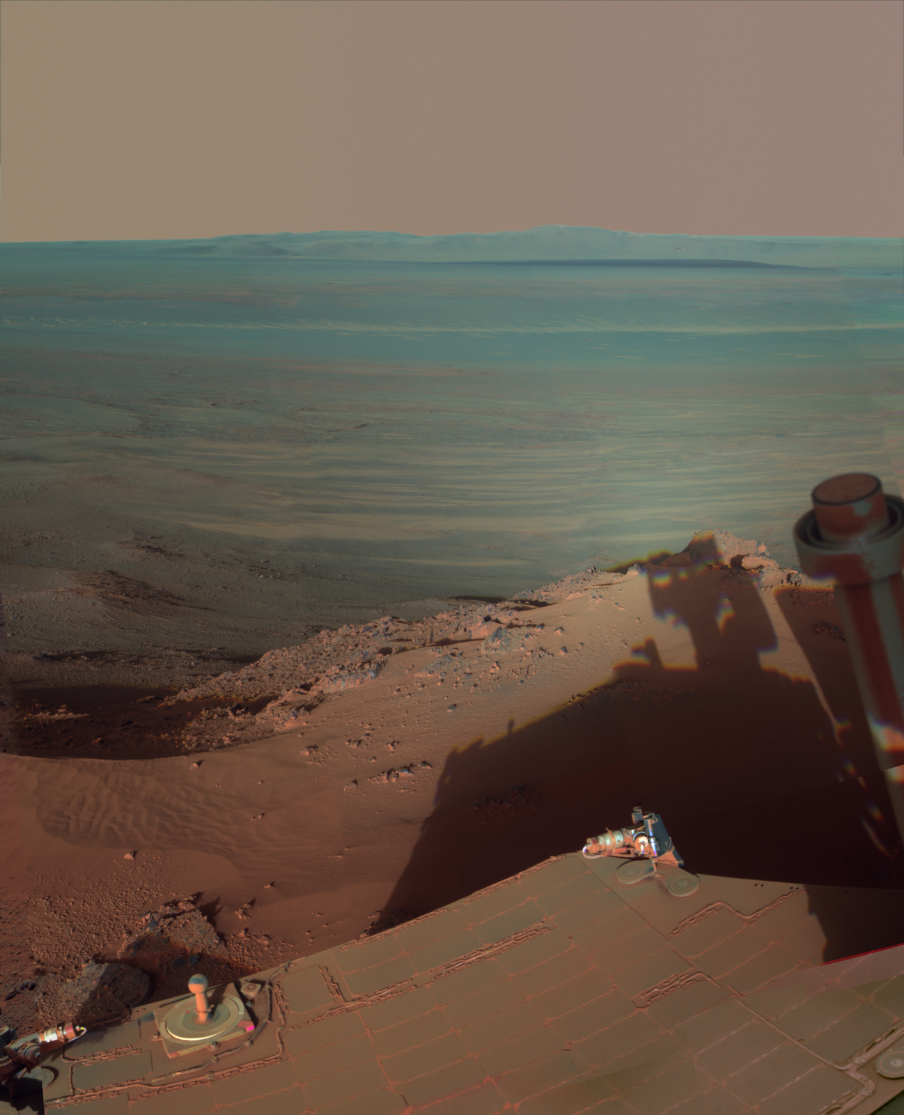 Long afternoon shadows from the rim of Endeavour crater, photographed by the NASA Mars Exploration Rover Opportunity on March 9, 2012