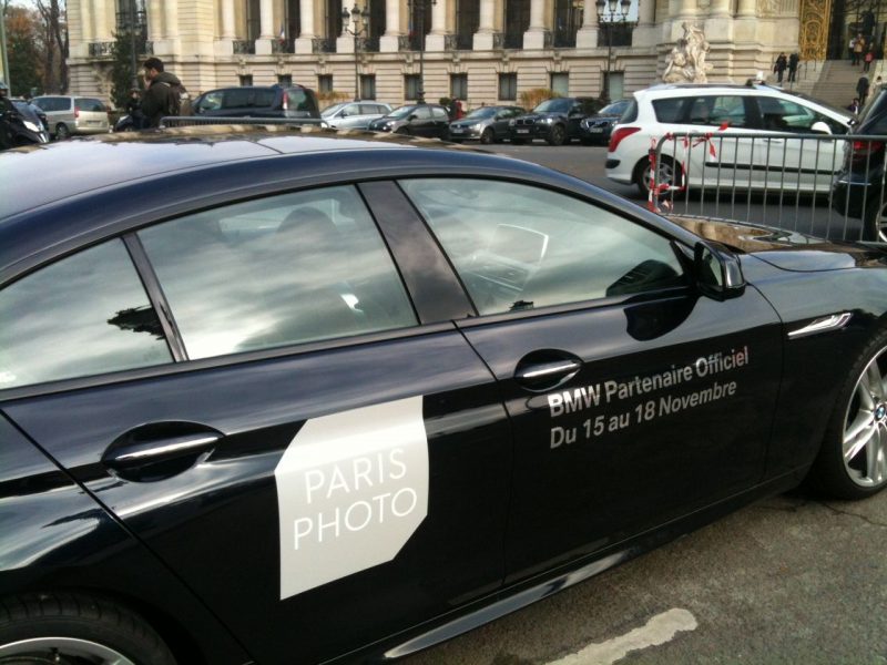 A BMW sporting the Paris Photo logo taxis visitors to the festival.