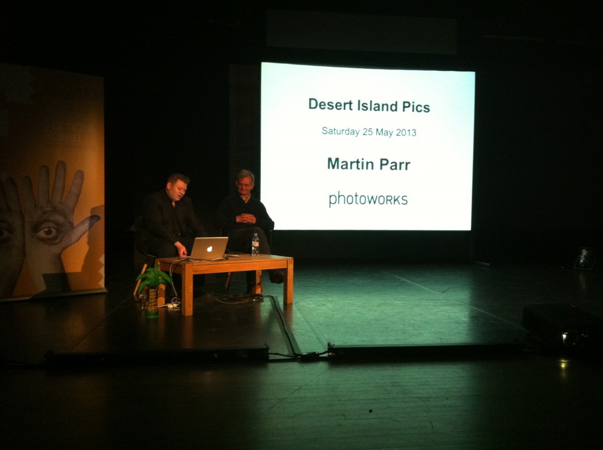 Martin Parr shares his choices for Desert Island Pics with Stephen Bull on the stage of the Brighton Dome - Corn Exchange during Brighton Festival 2013.
