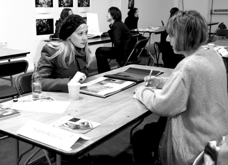 People at a photography portfolio review